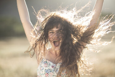 South Africa, Happy young woman dancing in field - ZEF002614