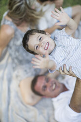 Father lifting boy up in the air - ZEF003616