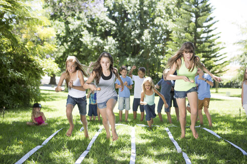 Girls competing in an egg-and-spoon race - ZEF002815