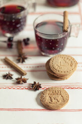 Home-baked almond biscuits, glasses of mulled wine and spices - SBDF002162