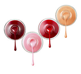 Four bottles of dripping nail polish in front of white background - RAMF000017