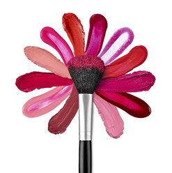 Lippenstift- und Nagellackstriche, die mit einem Puderpinsel eine Blumenform bilden - RAMF000034