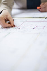 Close-up of architect working on construction plan - UUF002929