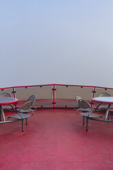 Germany, Hamburg, upper deck of a harbor ferry in dense fog - NKF000221