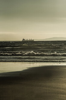 Spain, Andalusia, Tarifa, Freight ship in front of coast - KB000261