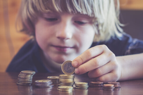 Little boy counting coins - SARF001172