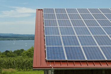Germany, Constance, Lake Constance, Solar panel on roof of a barn - JEDF000204