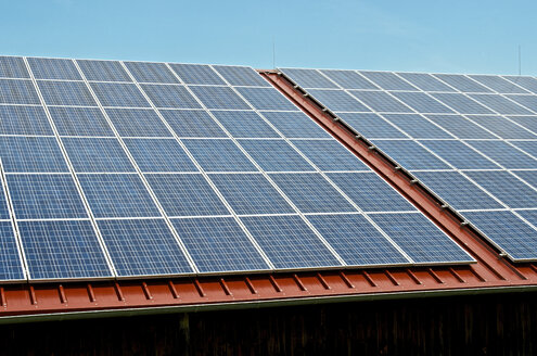 Germany, Constance, Solar panel on roof of a barn - JEDF000205