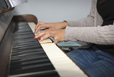 Young woman playing piano - LAF001271