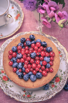 Still life with blueberries and red currant on the rural style table - VTF000368