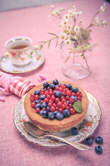 Still life with blueberries and red currant on the rural style table - VTF000367