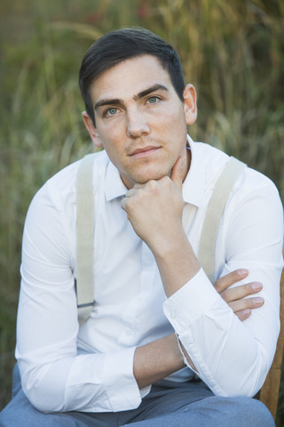Portrait of young man outdoors stock photo