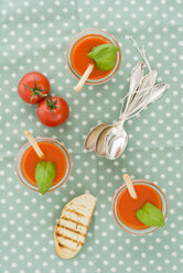 Tomato cream soup with grissini and baguette in glasses - ECF001628