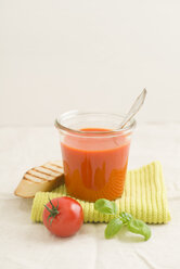 Tomato cream soup in a glass, baguette slice - ECF001632