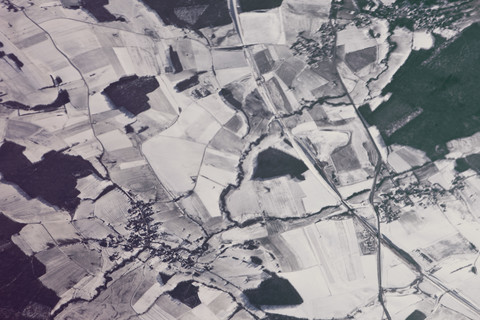 View of town in snowy fields as seen from an airplane stock photo