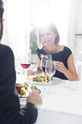 Elegant couple having dinner in restaurant - WESTF020424