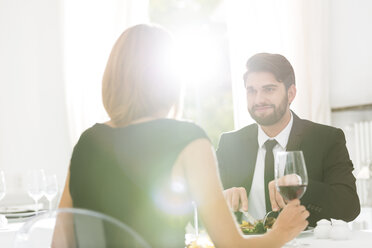 Elegant couple having dinner in restaurant - WESTF020427