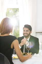 Elegant couple having dinner in restaurant - WESTF020428