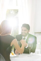 Elegant couple having dinner in restaurant - WESTF020429