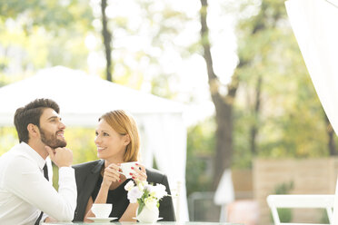 Smiling couple at outdoor cafe - WESTF020436