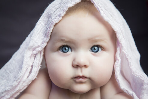 Portrait of baby girl with cloth on head - JTLF000025