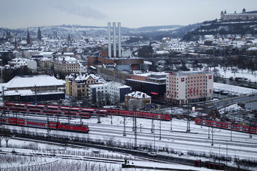 Germany, Wuerzburg, cityscape with trains in winter - NDF000492