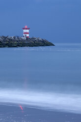 Netherlands, South Holland, The Hague, Scheveningen, Lighthouse in the evening - WIF001215