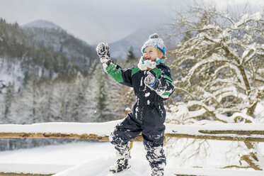 Germany, Bavaria, Berchtesgadener Land, happy boy in winter landscape - MJF001412