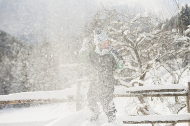 Germany, Bavaria, Berchtesgadener Land, happy boy in winter landscape - MJF001413