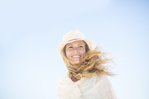 Smiling woman under blue sky - ZEF003395