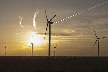 Netherlands, Zeeland, wind turbines at sunset - NNF000326