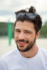 Portrait of smiling young man outdoors - WESTF020728