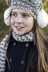 Portrait of girl wearing ear muff and wool cap - MGOF000004