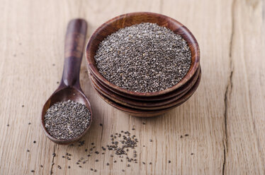 Stack of wooden bowl with chia seeds and wooden spoon on wood - ODF001009