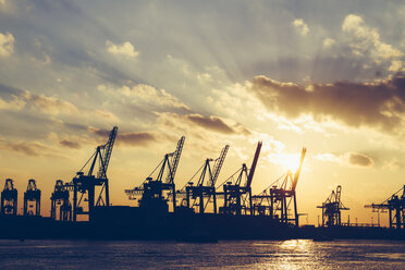 Germany, Hamburg, container cranes at sunset - KRPF001257