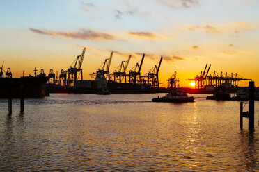 Germany, Hamburg, harbour, cranes at Elbe river at sunset - KRPF001277
