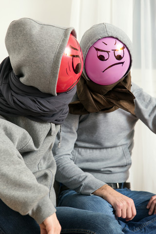 Two angry balloon persons side by side stock photo
