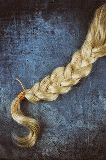 Blond braid on wooden background - ON000795