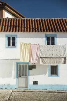 Portugal, Centro Region, Nazare, Laundry on clothes line - KBF000287