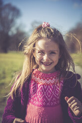 Portrait of smiling litte girl with pink knit pullover - SARF001234