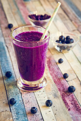 Glass of blueberry beetroot smoothie with chia seeds - SARF001240