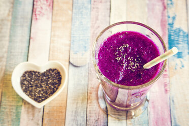 Glass of blueberry beetroot smoothie with chia seeds - SARF001243