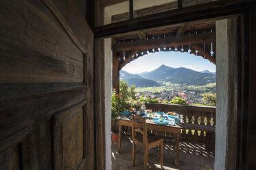 Austria, Salzburg State, Altenmarkt-Zauchense, laid breakfast table on veranda of old farmhouse - HHF005055