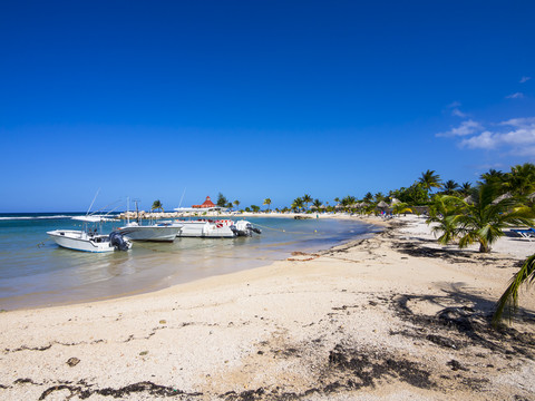 Jamaica, Runaway Bay, beach with motorboats stock photo