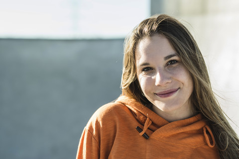 Portrait of smiling teenage girl outdoors stock photo