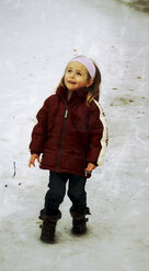 Little girl standing in snow - SARF001381