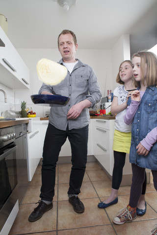 Man preparing pancakes stock photo