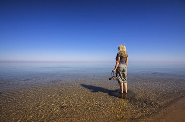 USA, Michigan, woman relaxing at Lake Huron - SMAF000291