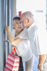 Senior couple at shopping tour - ZEF003755