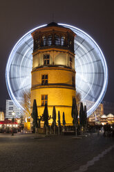 Germany, Duesseldorf, Burgplatz with donjon and ferris wheel at night - WIF001373